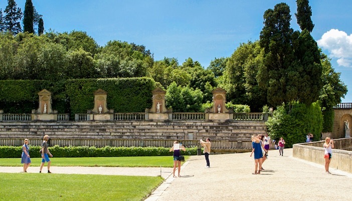 Tourists at the historic Amphitheatre in Boboli Gardens, Florence, Italy.