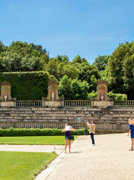 Tourists at the historic Amphitheatre in Boboli Gardens, Florence, Italy.