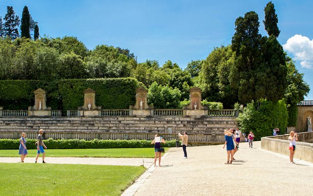 Tourists at the historic Amphitheatre in Boboli Gardens, Florence, Italy.