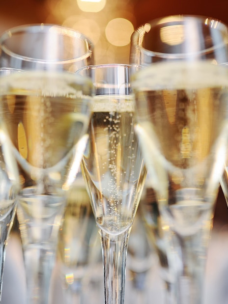 Champagne glasses filled for New Year's Eve dinner in Paris.