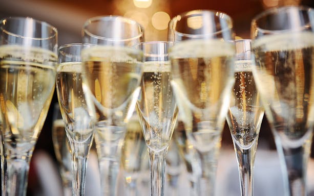 Champagne glasses filled for New Year's Eve dinner in Paris.
