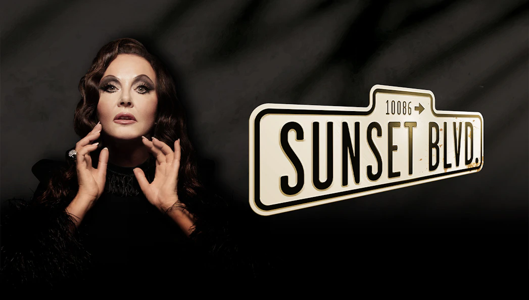 Person posing dramatically next to Sunset Boulevard sign