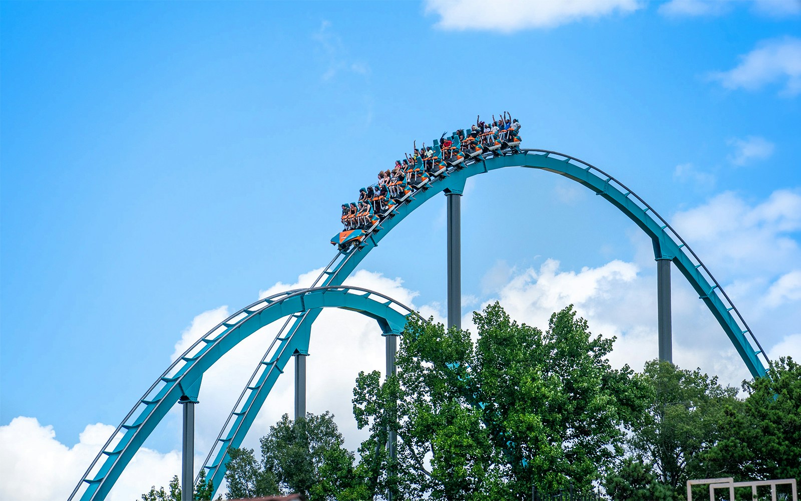 Goliath rollercoaster at Six Flags Over Georgia with riders on a steep drop.