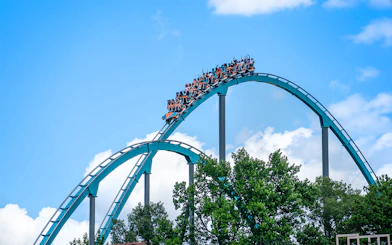 Goliath rollercoaster at Six Flags Over Georgia with riders on a steep drop.