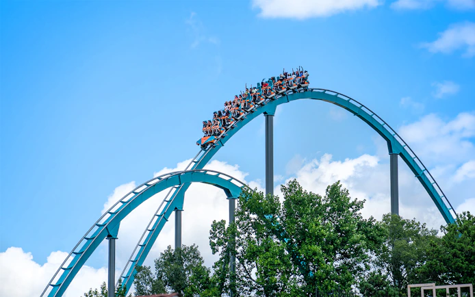 Goliath rollercoaster at Six Flags Over Georgia with riders on a steep drop.