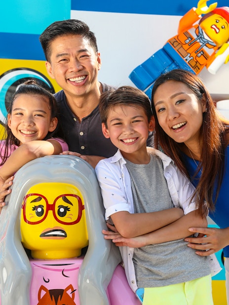 Family enjoying Legoland California with colorful Lego figures, included in San Diego All-Inclusive Pass.