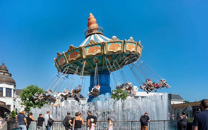 Wellenflug swing ride with people at Phantasialand, Berlin theme park.