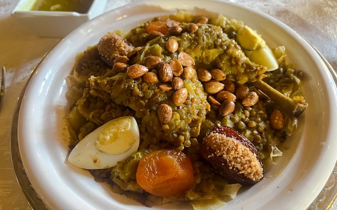 Moroccan dish with lentils, almonds, and boiled egg served in Casablanca, Morocco.