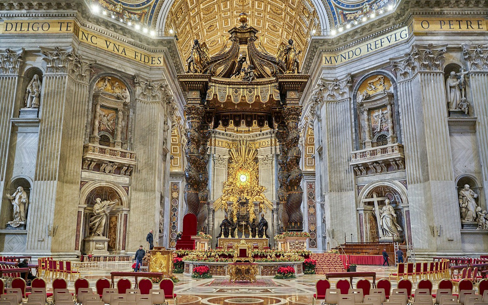St. Peter's Baldachin inside St. Peter's Basilica, ornate altar and columns.