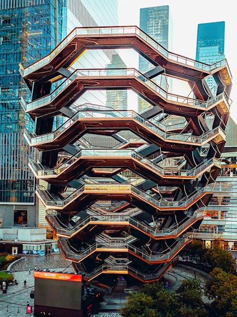 Vessel structure in New York City surrounded by skyscrapers.