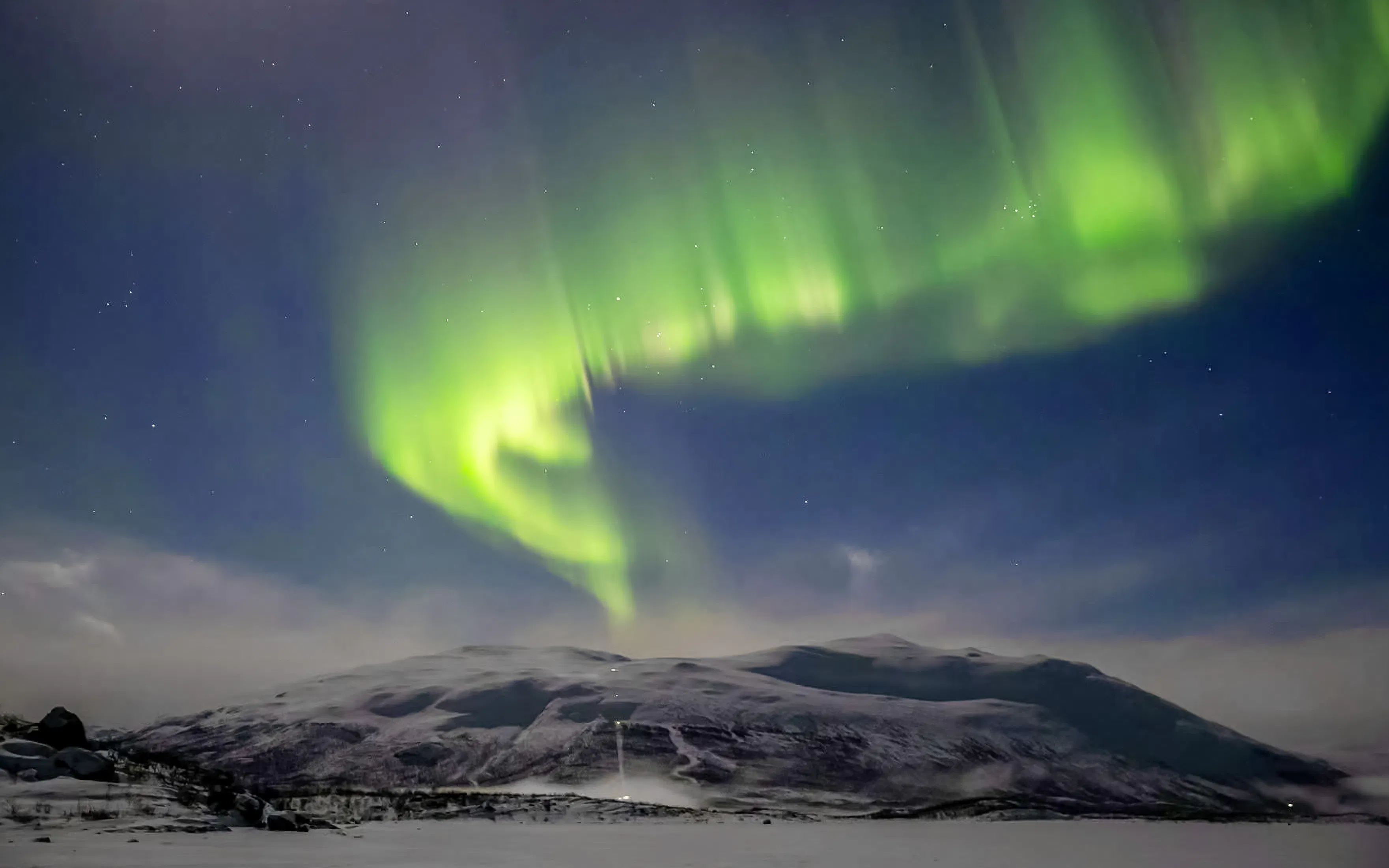 Northern lights over Mount Nuolja in Abisko National Park, Sweden.