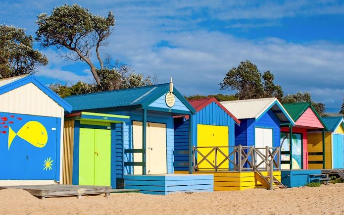 Colorful beach huts on Mornington Peninsula, Australia, near a winery tour location.