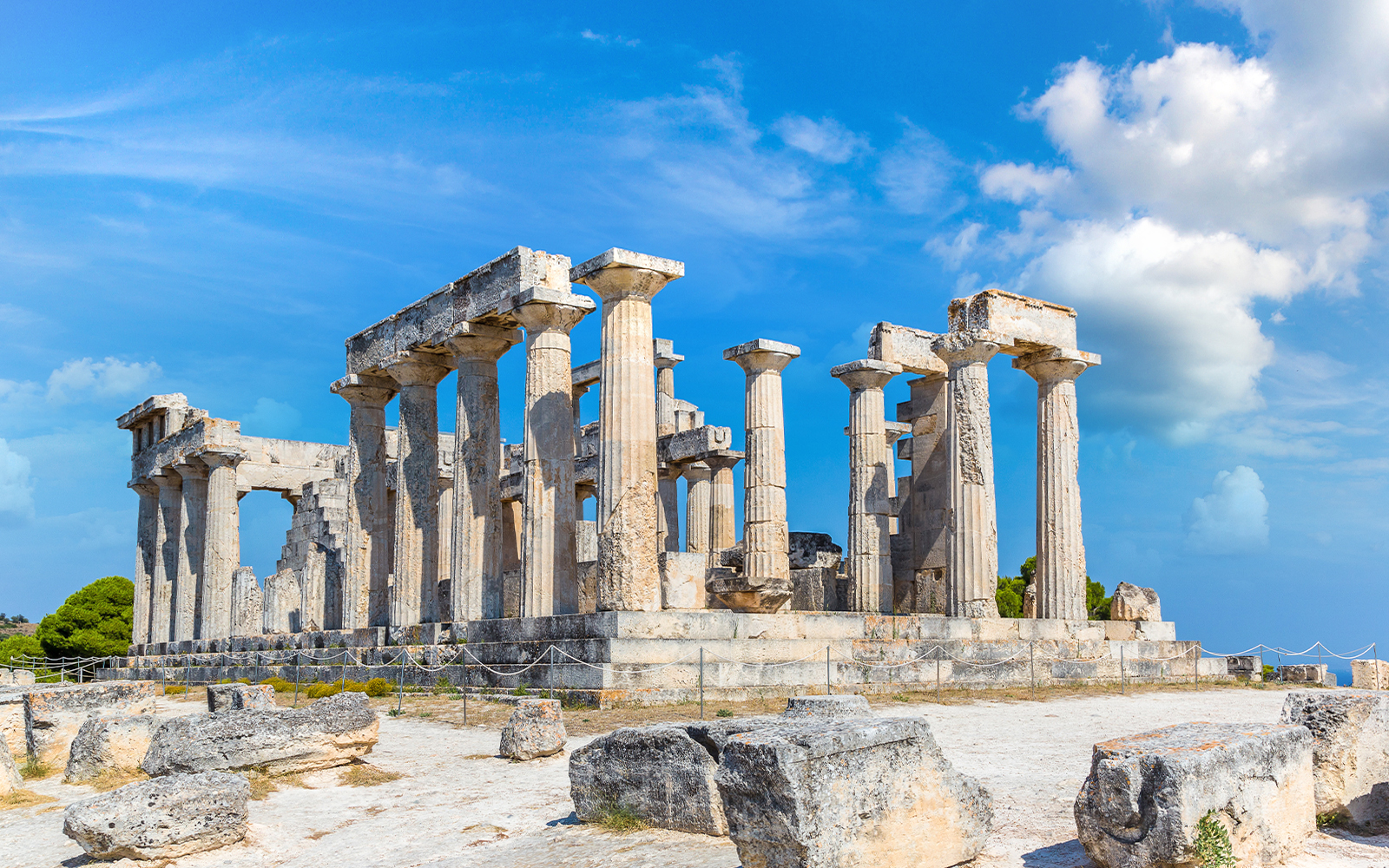 Ancient Temple of Aphaia on Aegina Island under blue sky.