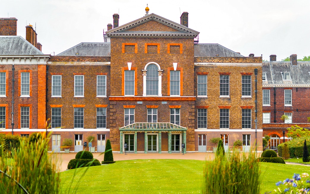 Kensington Palace facade with manicured gardens, London.