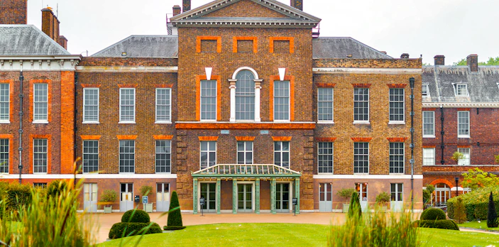 Kensington Palace facade with manicured gardens, London.