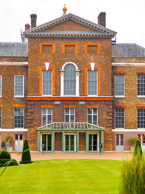 Kensington Palace facade with manicured gardens, London.