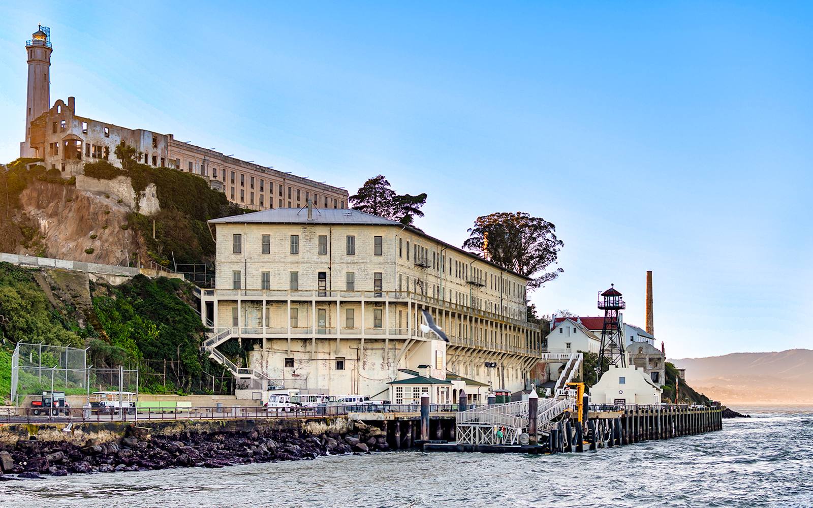 Alcatraz Island barracks, lighthouse, and ship dock in San Francisco, California.