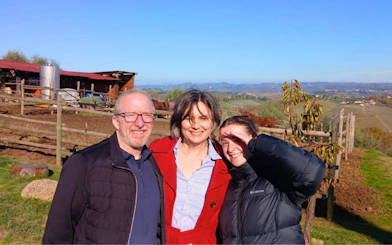 Visitors enjoying a Tuscan farm with vineyards in San Gimignano.