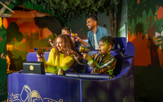 Visitors enjoying interactive ride at Cadbury World, Birmingham.