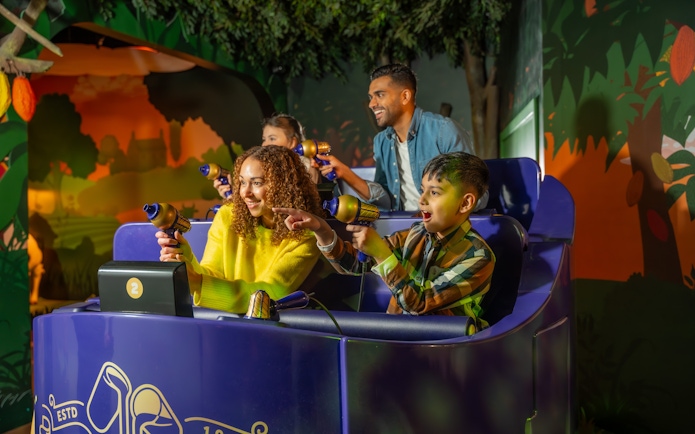 Visitors enjoying interactive ride at Cadbury World, Birmingham.