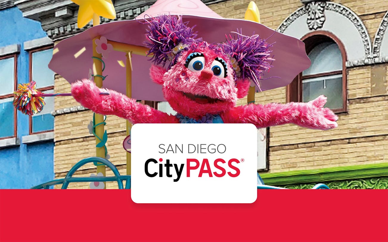 Colorful character on a ride at a San Diego theme park with CityPASS® logo.