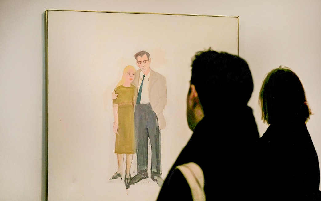 Visitors viewing a painting at the Guggenheim Museum, New York.