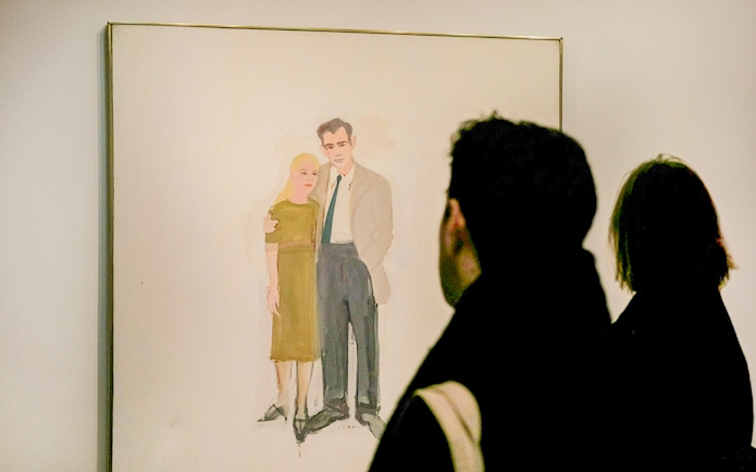 Visitors viewing a painting at the Guggenheim Museum, New York.