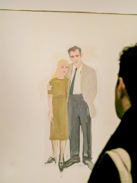 Visitors viewing a painting at the Guggenheim Museum, New York.