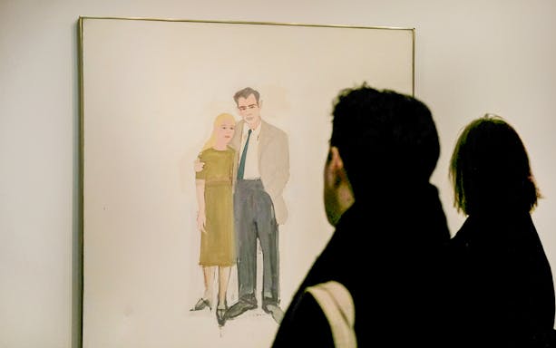 Visitors viewing a painting at the Guggenheim Museum, New York.