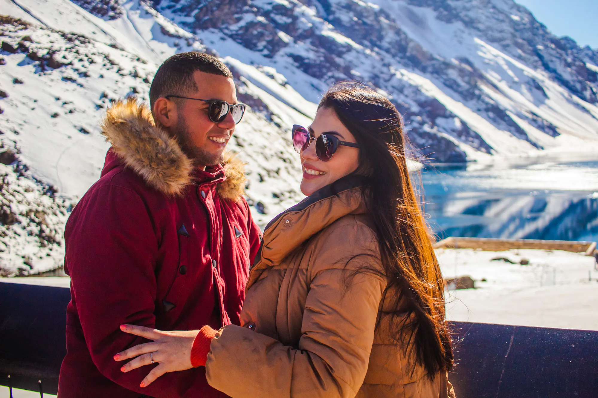 Couple enjoying snowy landscape at Laguna del Inca, Portillo, Chile.