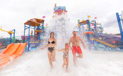 Family enjoying water splash at Andamanda Phuket Water Park.