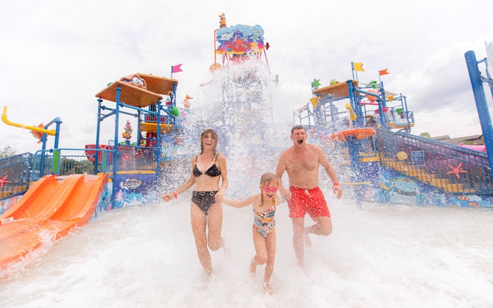 Family enjoying water splash at Andamanda Phuket Water Park.