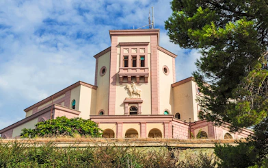 Villa of Zog in Durrës, Albania with detailed facade and surrounding greenery.