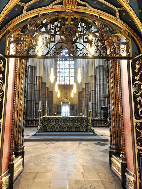 Westminster Abbey interior with ornate gate and altar, Royal London Tour.