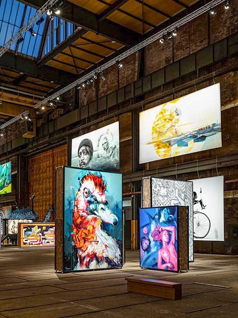 Colorful street art exhibits inside Straat Museum, Amsterdam.