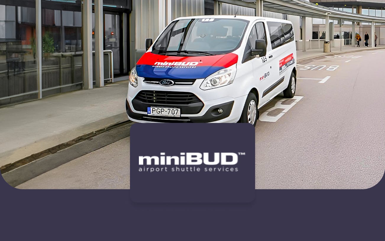 miniBUD shuttle van at Budapest Airport terminal curbside.
