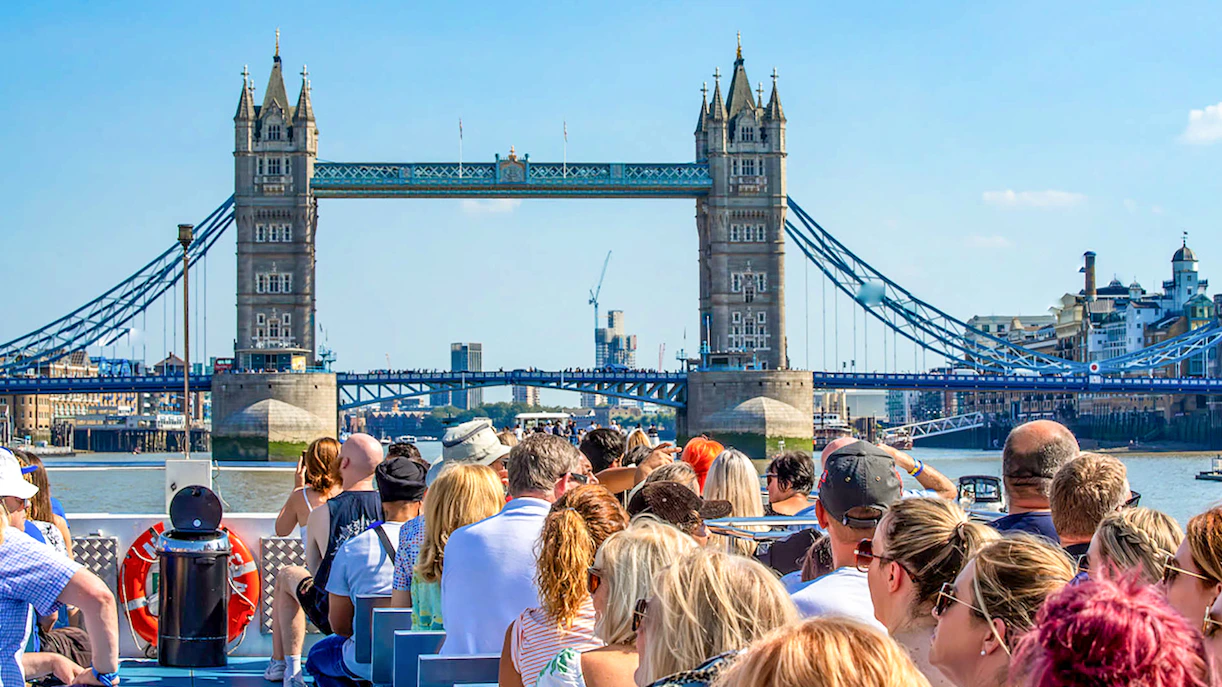 Sightseeing cruise on the Thames River with view of Tower Bridge, London.