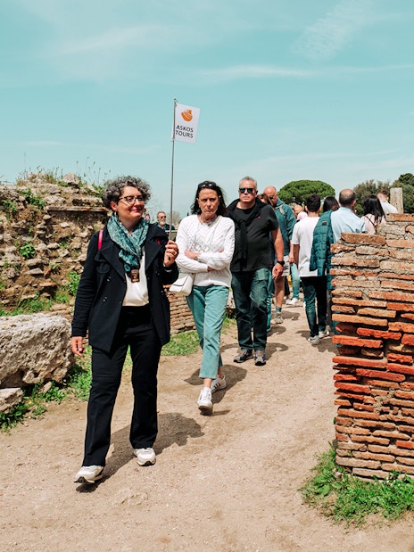 Visitors exploring Paestum Archaeological Site on a guided tour, Italy.