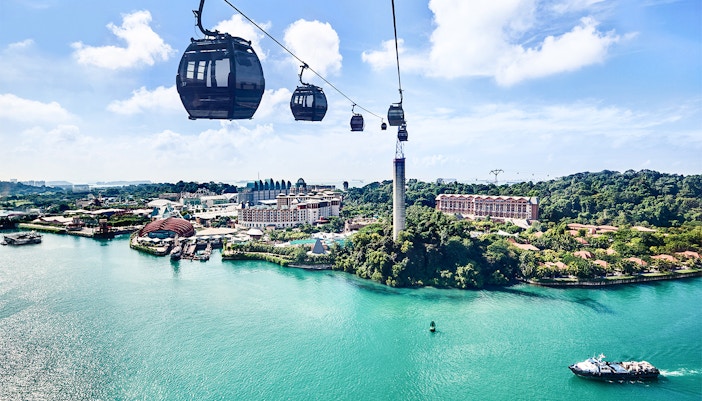 Singapore Cable Car over Sentosa Island with waterfront view.
