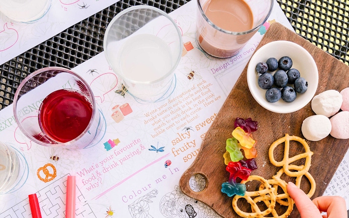 Wine tasting setup with glasses, blueberries, pretzels, and gummies at Tulloch Wines Hunter Heroes.