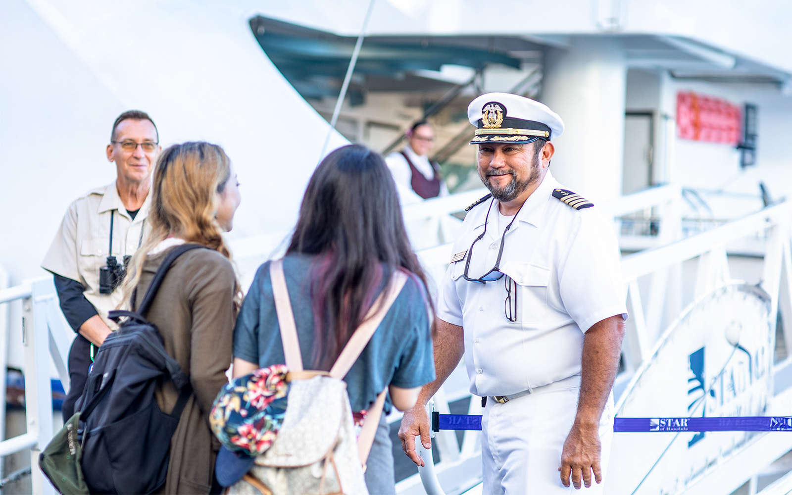 Cruise captain welcoming guests onboard in Oahu.