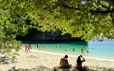 Tourists enjoying the beach and clear waters at Hong Islands, Krabi.
