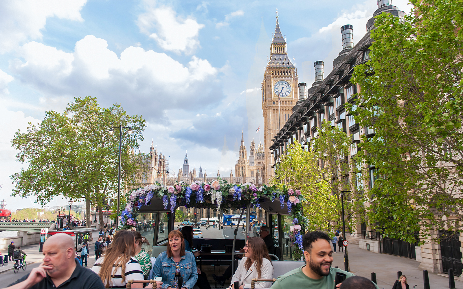 People enjoying view from Bar Bus near Big Ben, London.