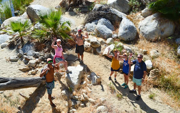 Hikers exploring Fox Canyon trail in Los Cabos, Mexico on a guided tour.