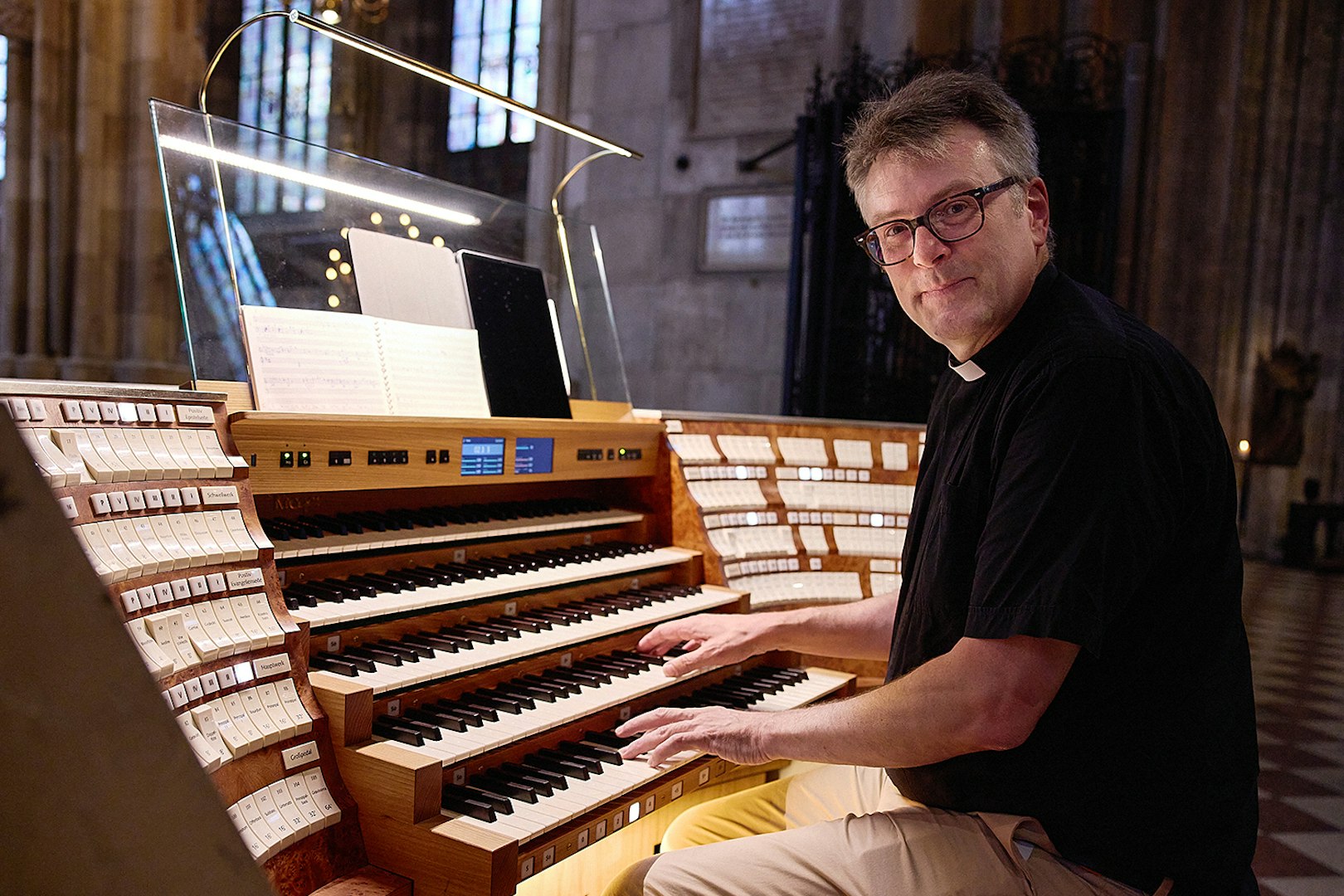Organist playing the giant organ at St. Stephen's Cathedral concert.