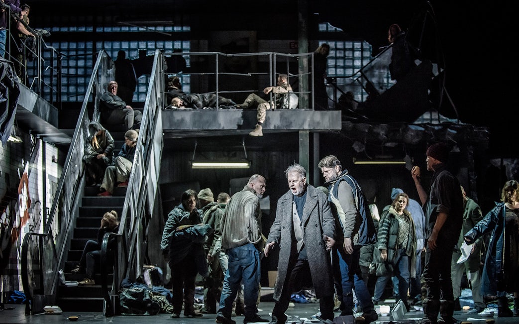 Opera performers on stage during La Forza del Destino, dramatic scene with multiple actors.