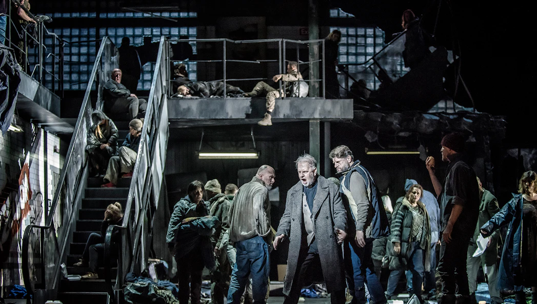 Opera performers on stage during La Forza del Destino, dramatic scene with multiple actors.