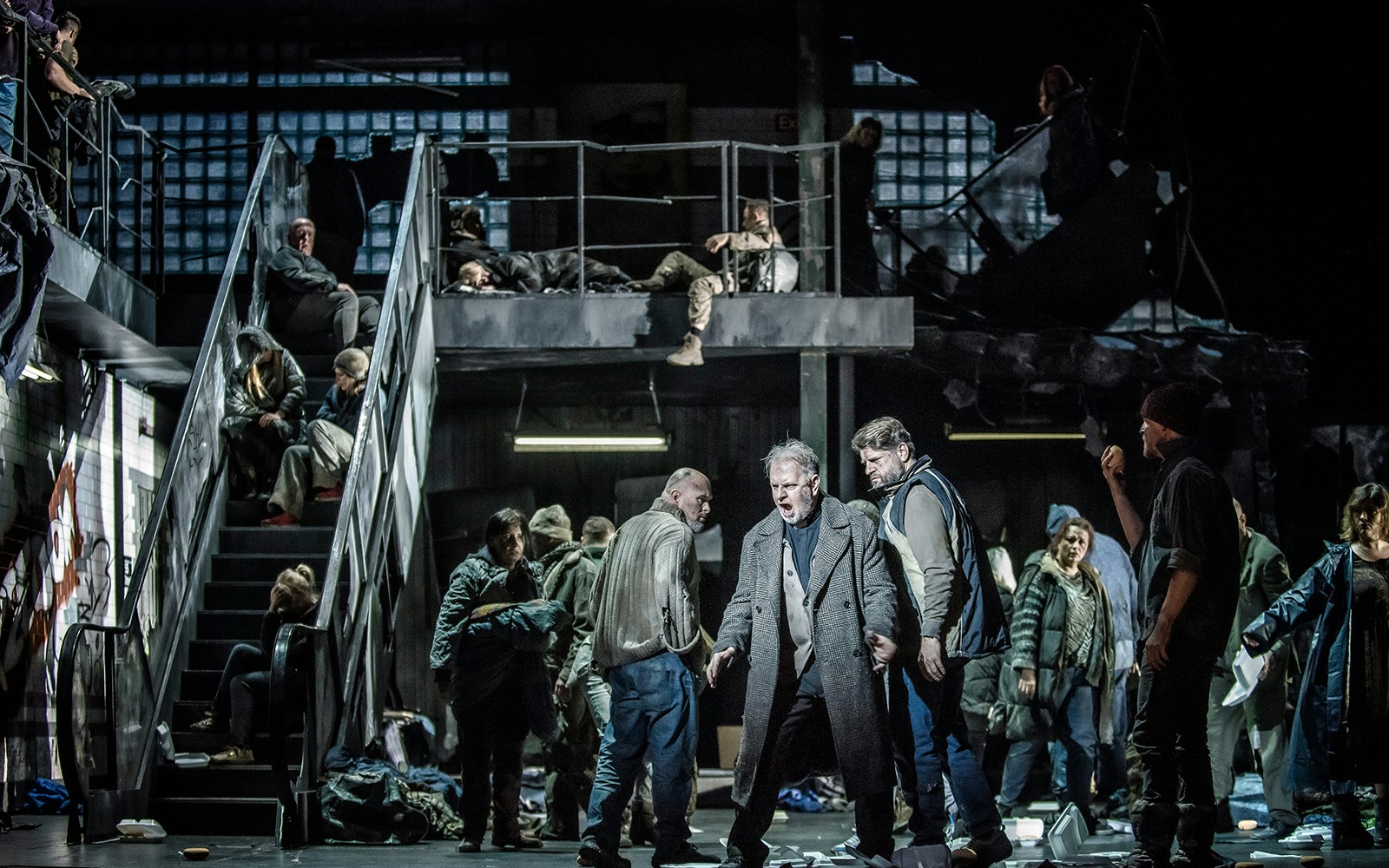 Opera performers on stage during La Forza del Destino, dramatic scene with multiple actors.
