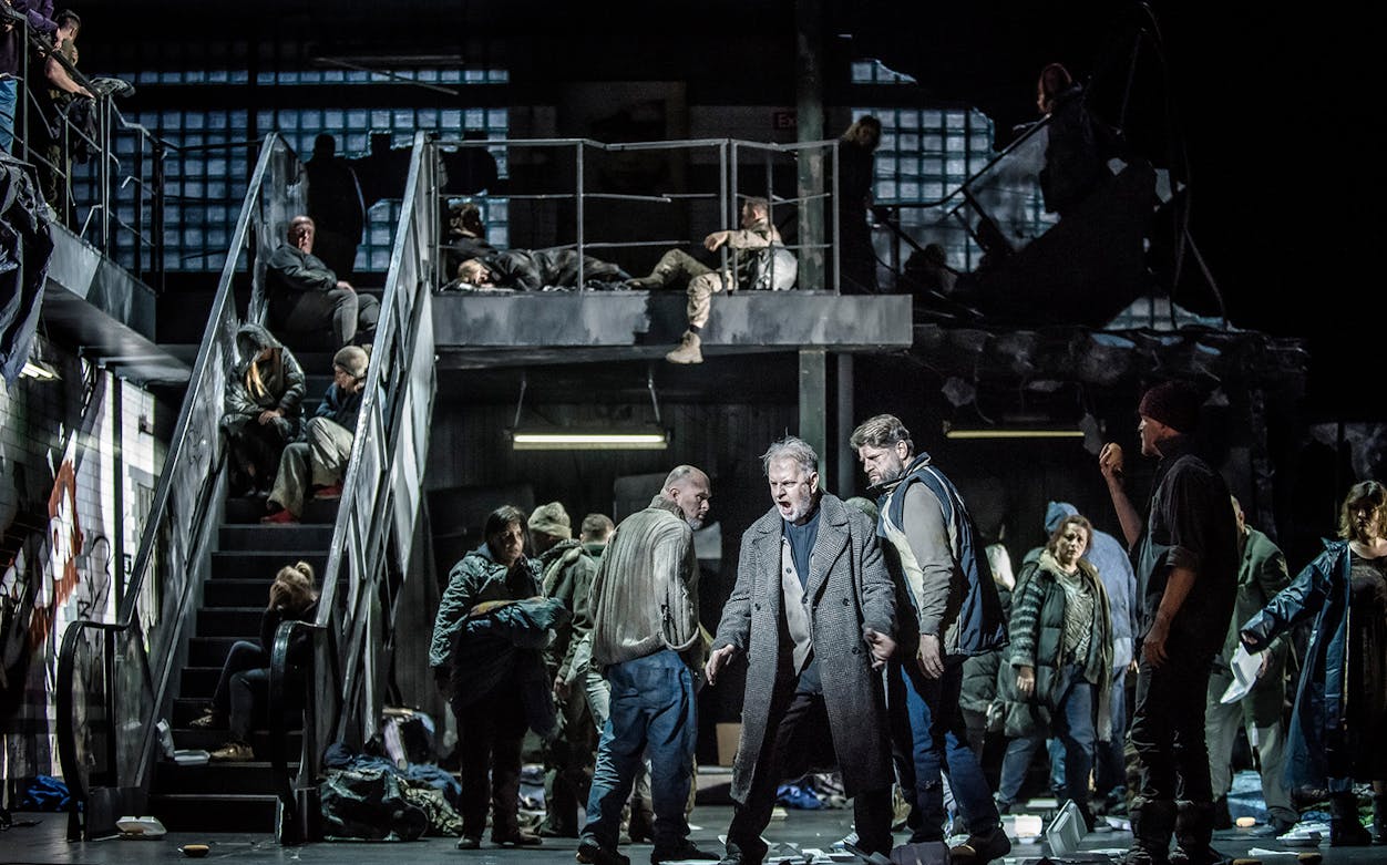 Opera performers on stage during La Forza del Destino, dramatic scene with multiple actors.