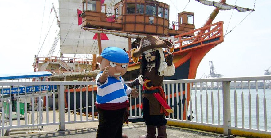 Pirate and sailor mascots on dock in front of Santa Maria cruise ship, Osaka.